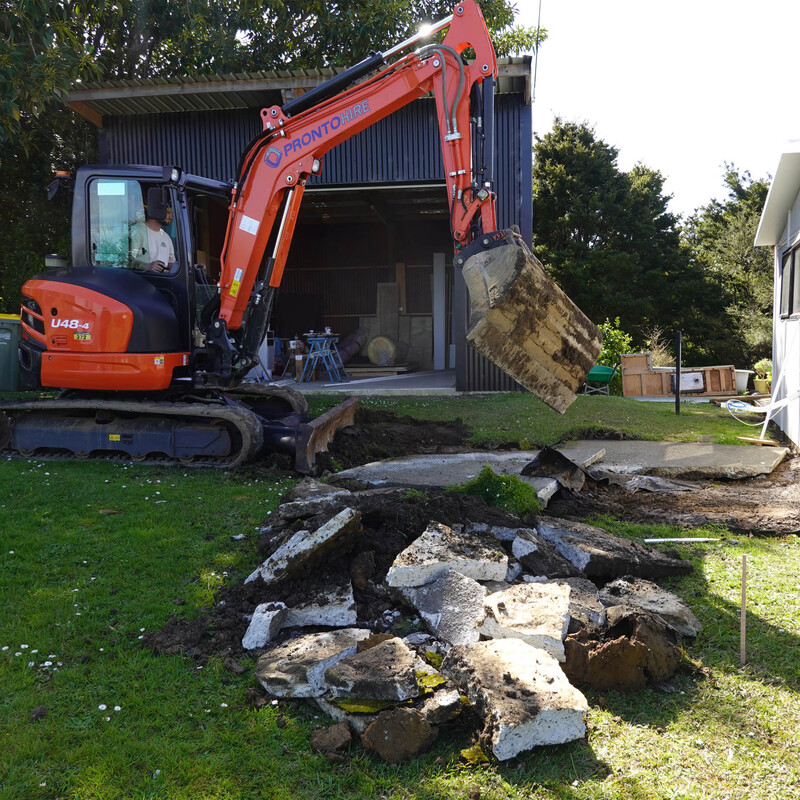 Called on the guys over the road to help pull up the old concrete pad
